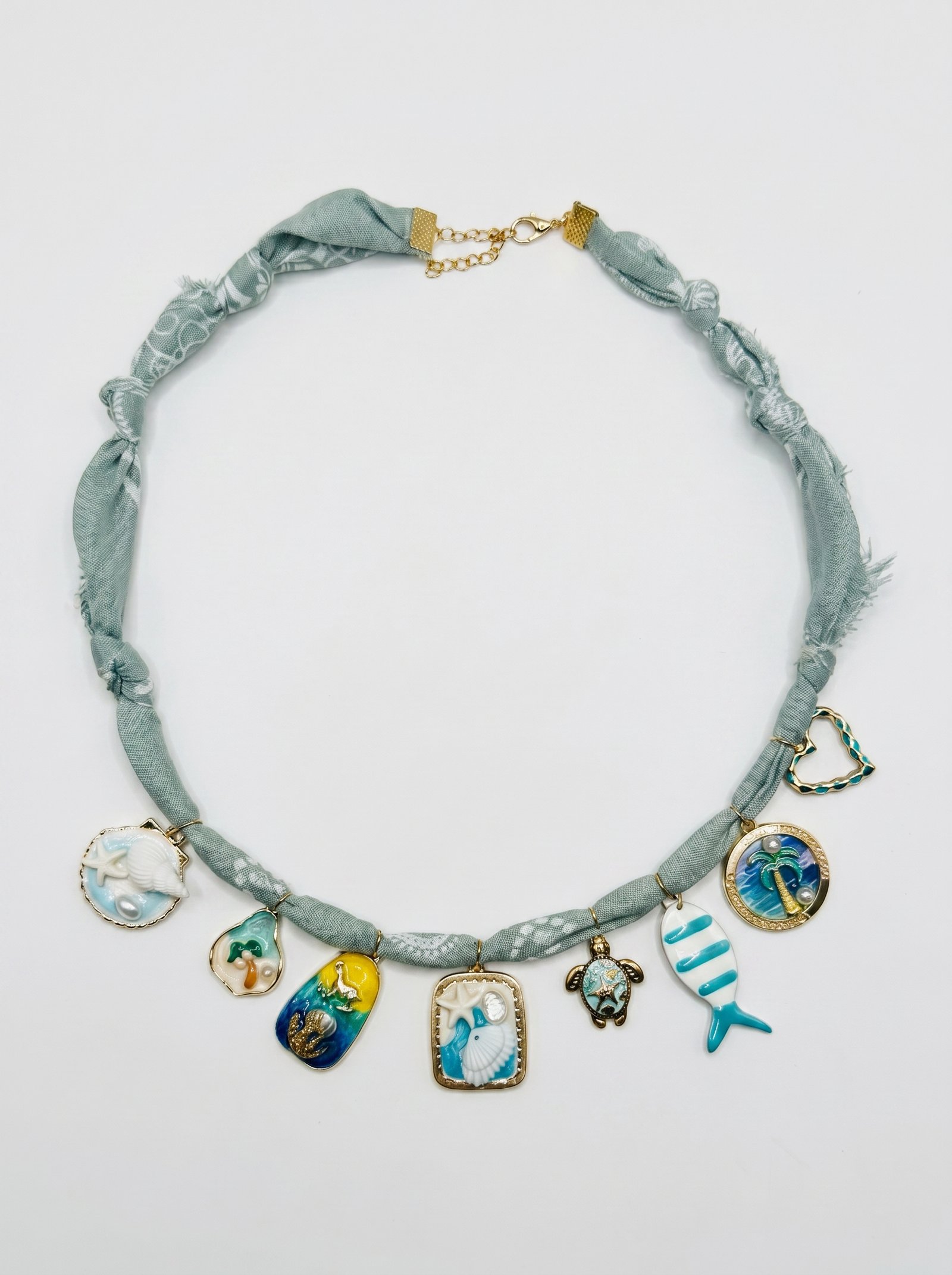 https://veline.ae/storage/photos/1/Charm Necklaces/Grey_Sea_Charms.JPG